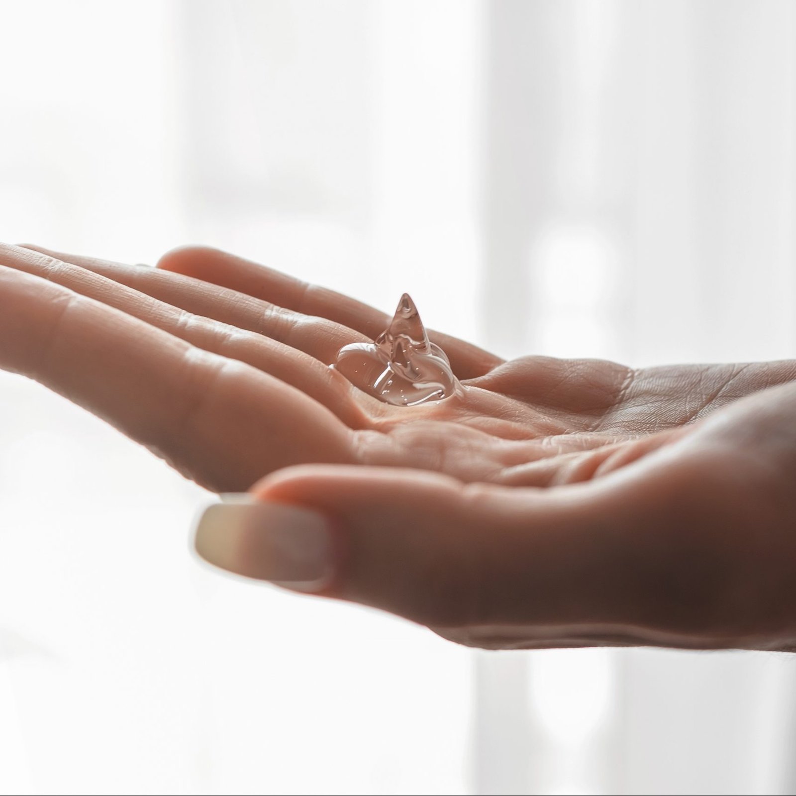 Antibacterial sanitizer gel on woman hands. Hygiene concept. Prevent the spread of germs and bacteria and avoid infections corona virus.