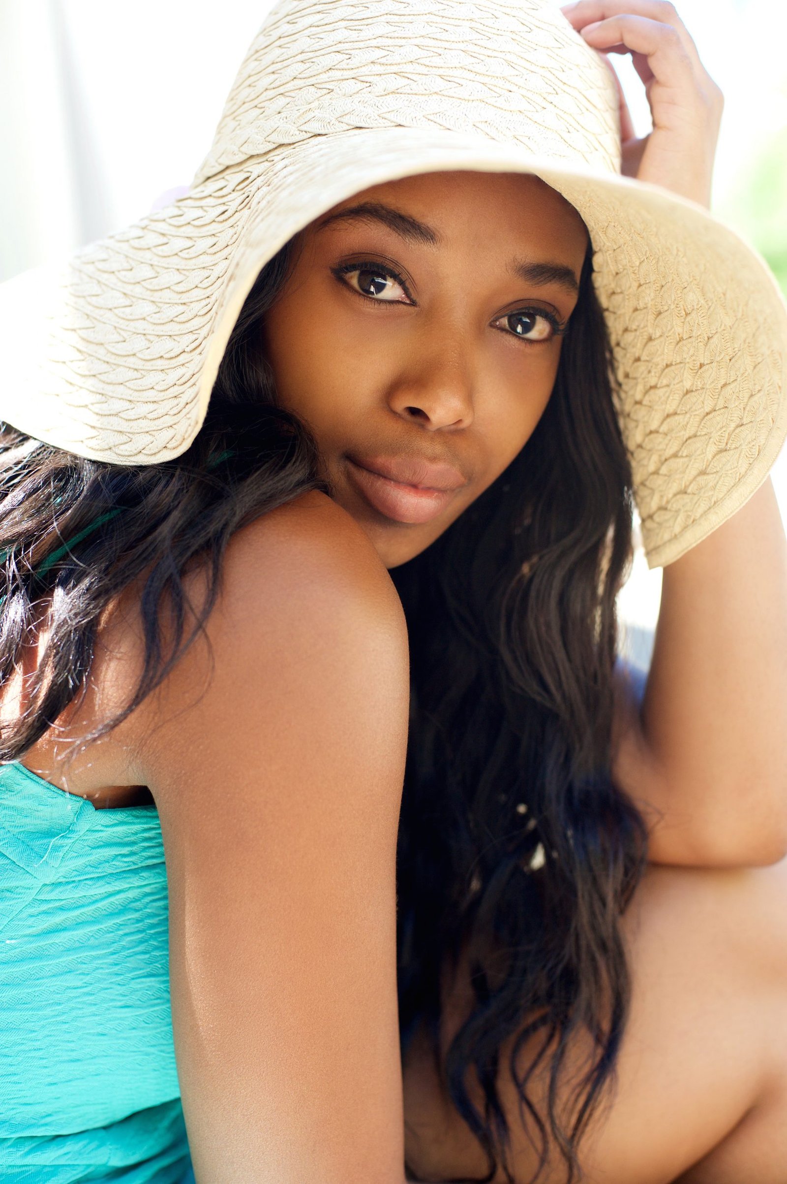 Beautiful black Siscare girl with sun hat